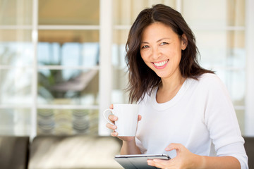 Portrait of an Asian woman smiling.