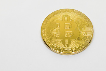 gold metal coin cryptocurrency bitcoin on white background