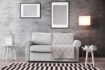 Beautiful trendy room interior with comfortable sofa