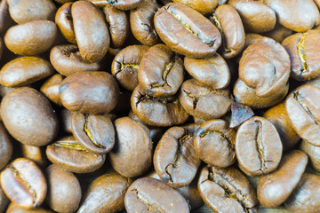 Roasted coffee beans close-up. Background from coffee beans.