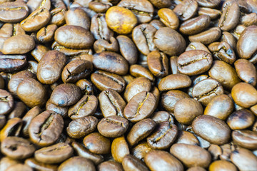 Roasted coffee beans close-up. Background from coffee beans.