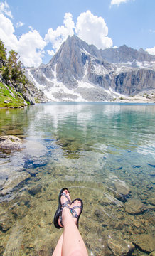 Girl Wearing Sandals at Beautiful Mountain Lake