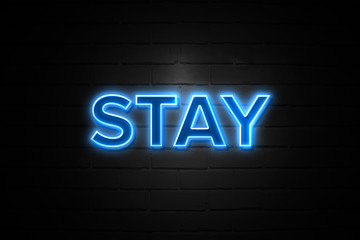 Stay neon Sign on brickwall