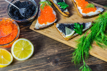 Festive sandwiches with red and black caviar. Healthy and tasty food.