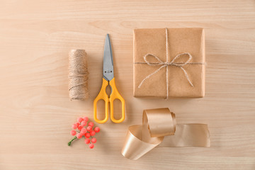 Fototapeta na wymiar Composition with parcel gift box on wooden background