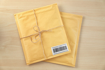 Gift padded envelopes on wooden table