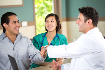 Medical team talking with patients.