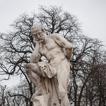 Stone statue representing Marius de Victor Vilain inside the Luxembourg gardens, one of the largest public parks in Paris.