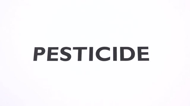 PESTICIDE prohibition symbol, toxic substances ban writing with copy space. No insecticide, chemical free, pollution reducing, negative sign with white background. Concept of organic agriculture
