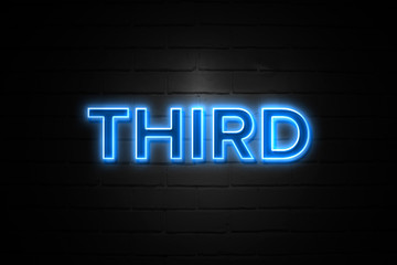Third neon Sign on brickwall