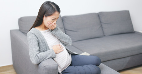 Obraz premium Pregnant woman suffer from nausea