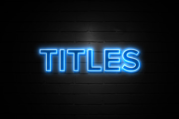 Fototapeta premium Titles neon Sign on brickwall