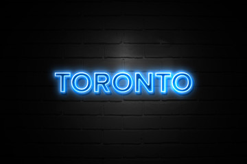 Toronto neon Sign on brickwall