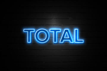 Total neon Sign on brickwall