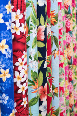 Rainbow Aloha Hawaiian Print Fabric on sale at the Swap Meet on Oahu, showing tropical hawaiian...