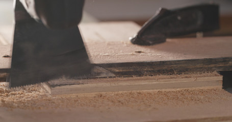 Cutting the wooden board