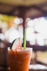 Tropical cocktail with straw in lights