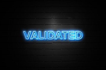 Obraz premium Validated neon Sign on brickwall