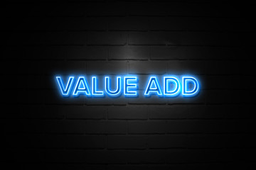 Value Add neon Sign on brickwall