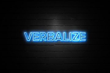 Verbalize neon Sign on brickwall