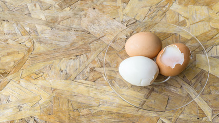 tree eggs on a chopping board from above,soft boil egg, copy space for text. cooking concept.