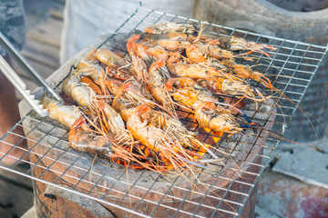 Grilled prawns,Grilled shrimp on grill with stove in background...