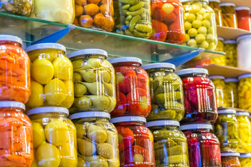 Store shelves with Various pickles in glass jar