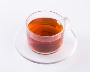 Tea in glass cup or glass cup of black tea on a background.