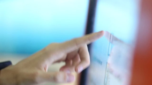girl using large touchscreen monitor