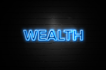 Wealth neon Sign on brickwall