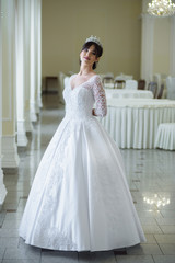 Fototapeta premium Beautiful bride in a wedding dress 