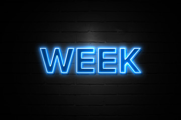 Week neon Sign on brickwall