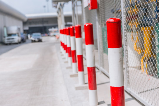 Non Parking space or danger space of Gas storage area do not approach red-white stripes pole.