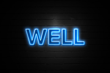 Well neon Sign on brickwall