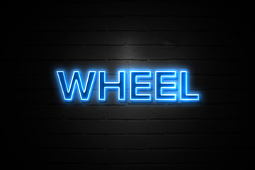 Wheel neon Sign on brickwall