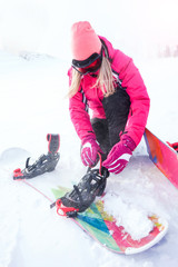 Sheregesh, Kemerovo region, Russia - January, 2018: Girl with snowboards on the mountain. Woman snowboarding in the winter.