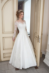 Fototapeta premium Beautiful bride in white interior