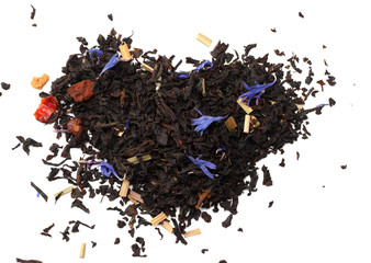 Aromatic black dry tea with petals isolated on white background top view