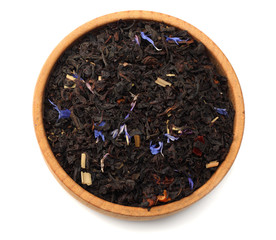 Aromatic black dry tea with petals isolated on white background top view