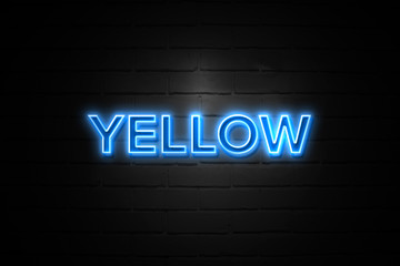 Yellow neon Sign on brickwall