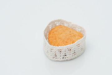Cake in a casket in the form of heart on a white background