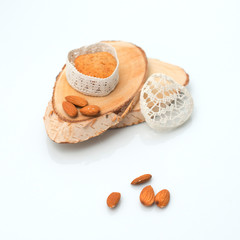 Cake in a casket in the form of heart on a section of wood