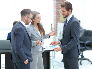 A satisfied business lady explains the statistics chart