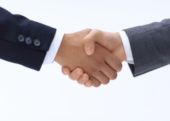 Obraz premium Closeup of business people shaking hands over a deal