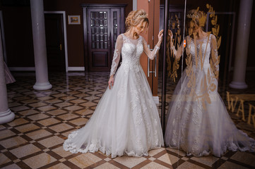 Fototapeta premium Beautiful bride in wedding dress interior