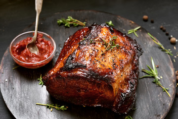Roasted pork on wooden board