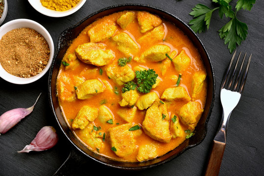 Tasty chicken curry in frying pan