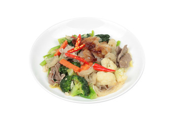 Isolated of Fried big noodle with chicken and vegetables.