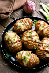 Baked stuffed potatoes with bacon, green onion and cheese