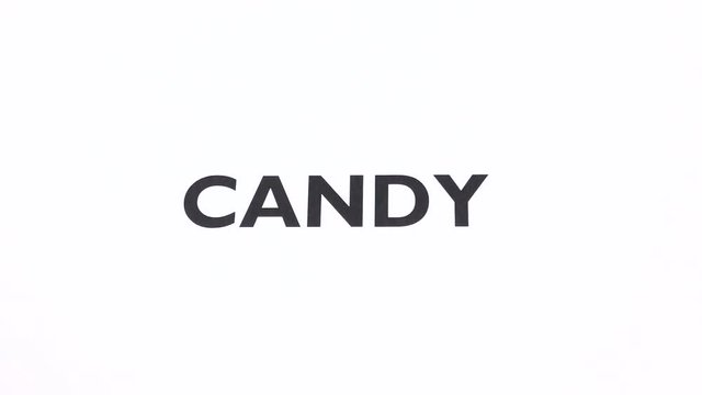 CANDY prohibition symbol, lose weight, sweet ban writing with copy space. No dessert, sugar free, cut down on confectionery, negative sign with white background. Concept of diet and healthy lifestyle